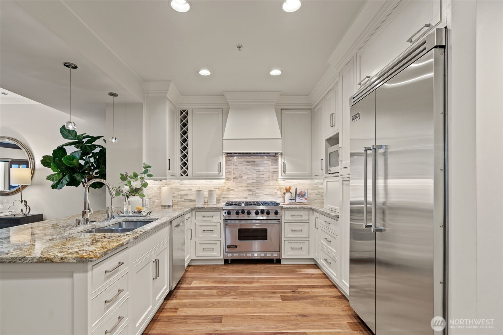 10616 Northeast 9th Place, Unit TH4 Bellevue, WA 98004 - Photo 10 of 39 a kitchen with stainless steel appliances granite countertop a refrigerator and a sink