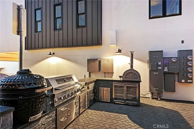 a kitchen with stainless steel appliances granite countertop a stove and a cabinets