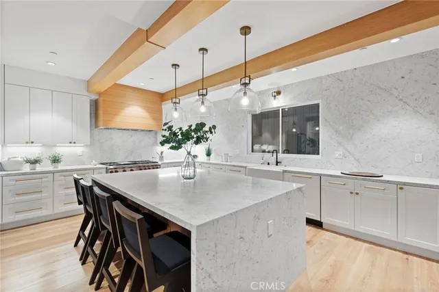 a kitchen with a table and chairs in it