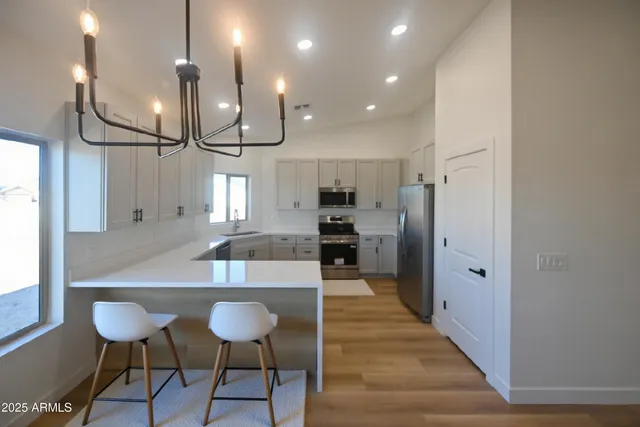 a large kitchen with lots of counter space and window