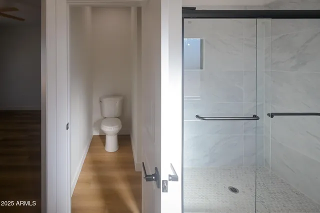 a view of a bathroom from a hallway