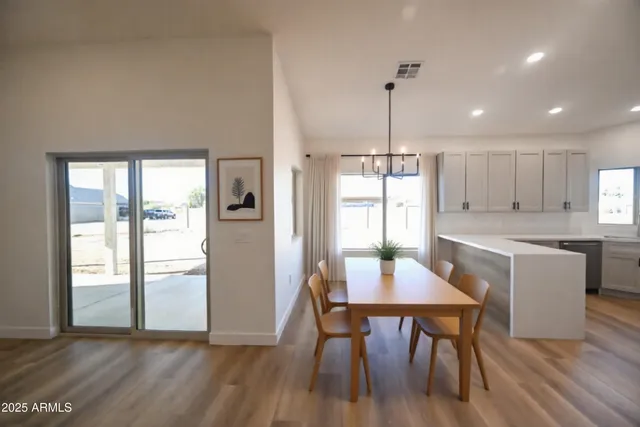 a kitchen with a table and chairs in it