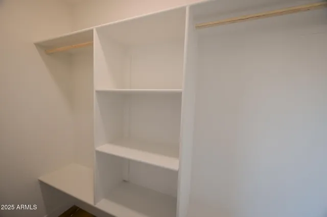 a view of an empty walk in closet