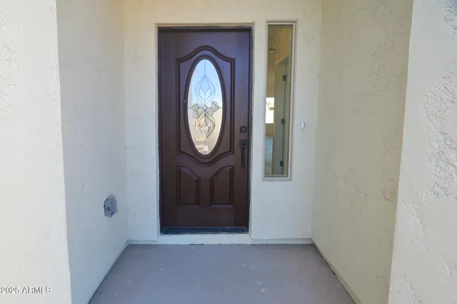 a view of a hallway with wooden door