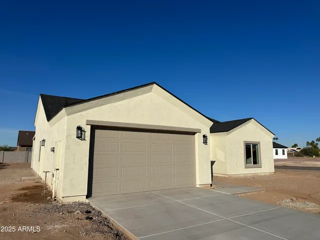 a view of a house with a house in the background