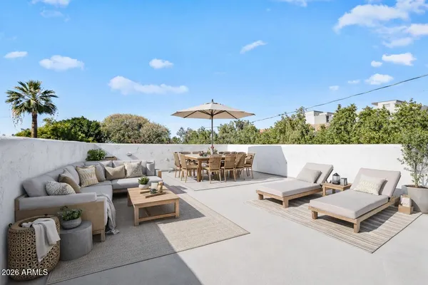 a outdoor living space with furniture and city view