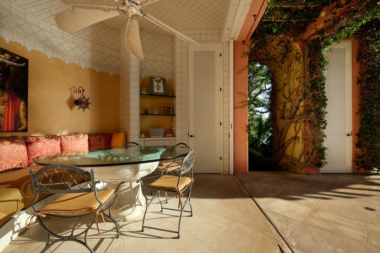 51 Hui Road East Lahaina, HI 96761 - Photo 36 of 49 a patio with table and chairs and potted plants