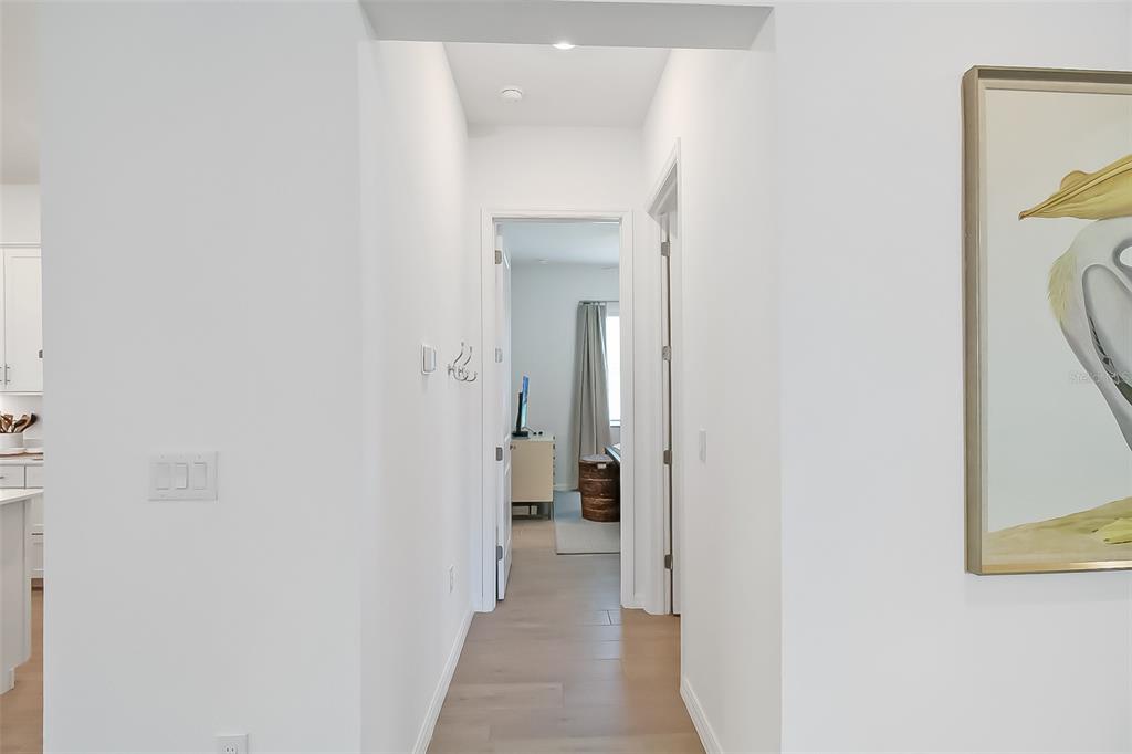 17335 Jadestone Court Venice, FL 34293 - Photo 15 of 54 a view of a hallway with wooden floor