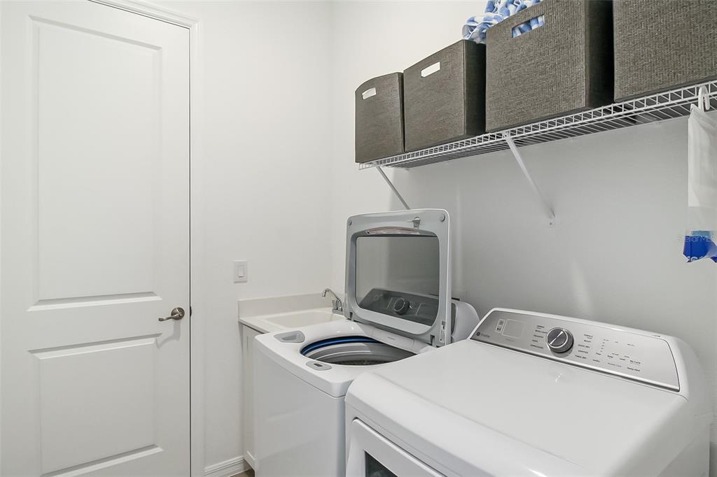 17335 Jadestone Court Venice, FL 34293 - Photo 16 of 54 a utility room with dryer and washer
