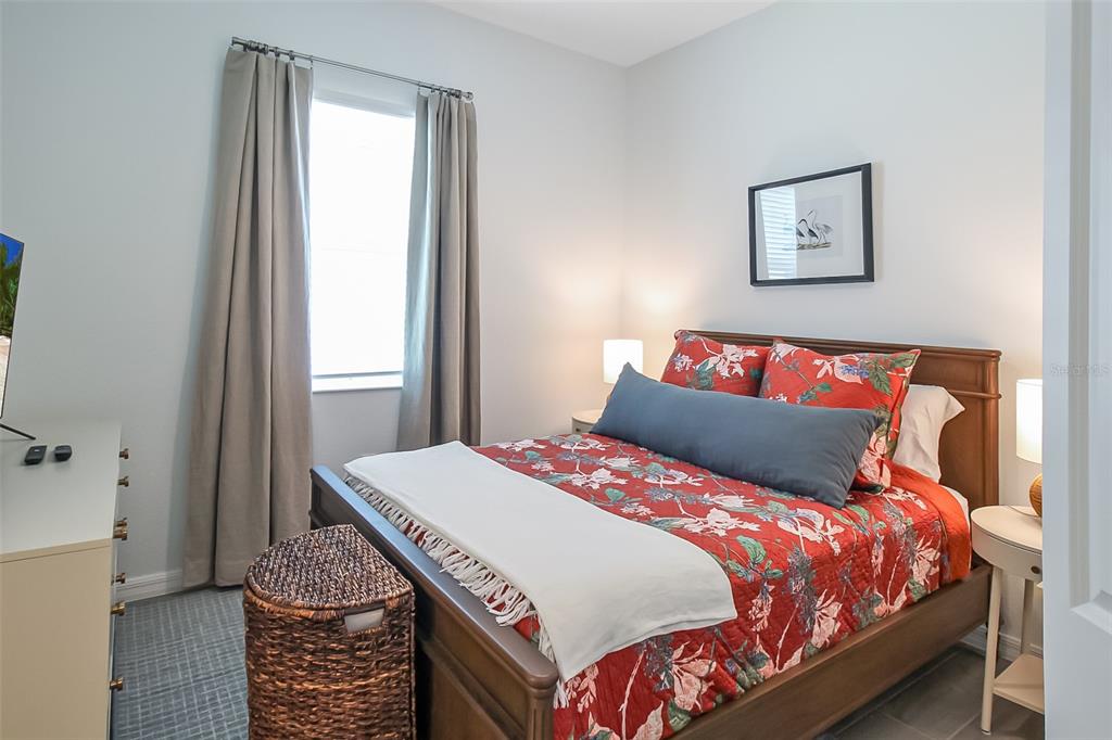 17335 Jadestone Court Venice, FL 34293 - Photo 17 of 54 a bedroom with a bed and a window