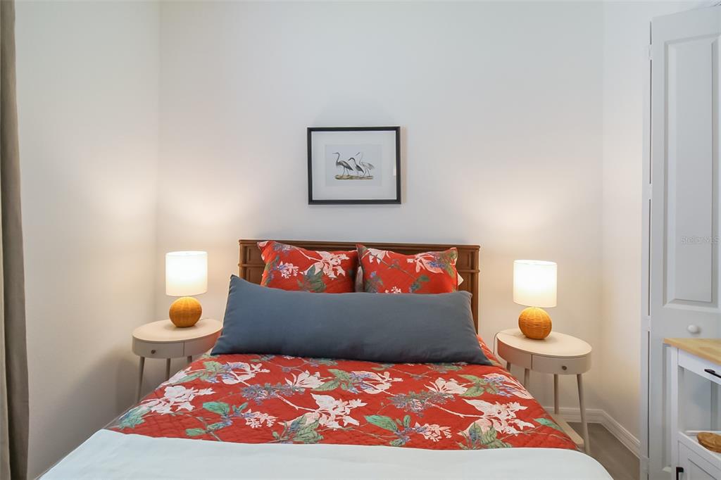 17335 Jadestone Court Venice, FL 34293 - Photo 18 of 54 a bedroom with a bed and window