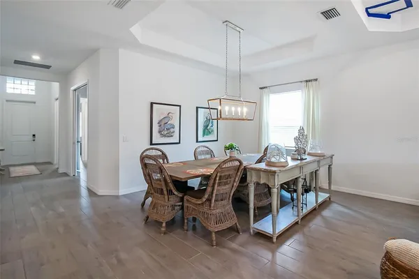 a kitchen with a sink a center island a counter space and a window