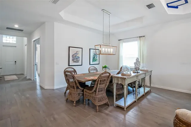 a kitchen with a sink a center island a counter space and a window