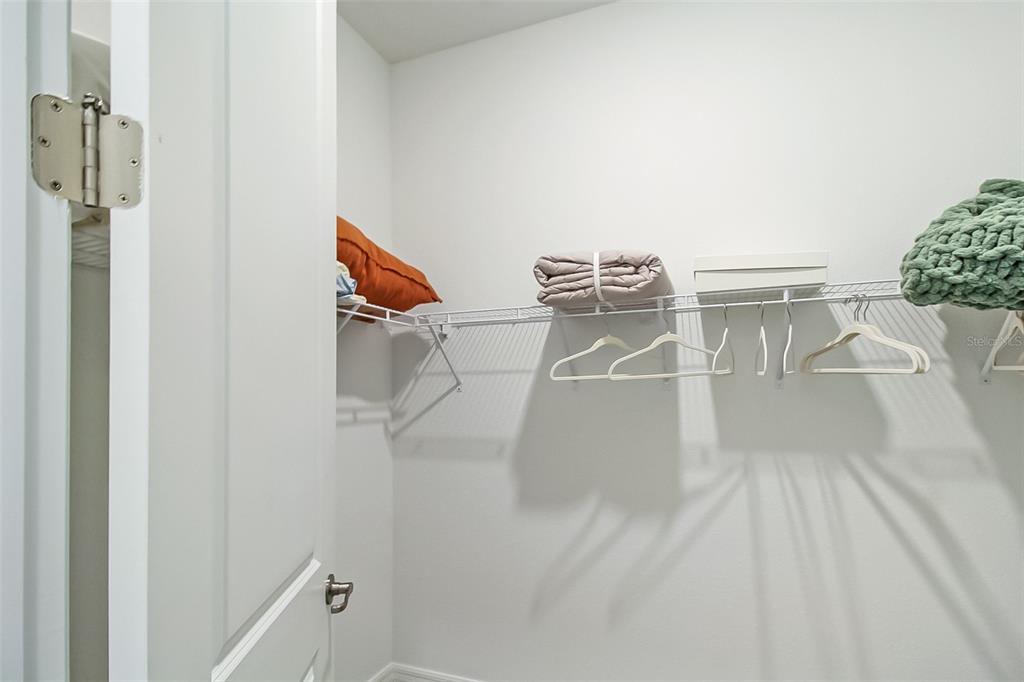 17335 Jadestone Court Venice, FL 34293 - Photo 40 of 54 a view of a room with racks on the wall