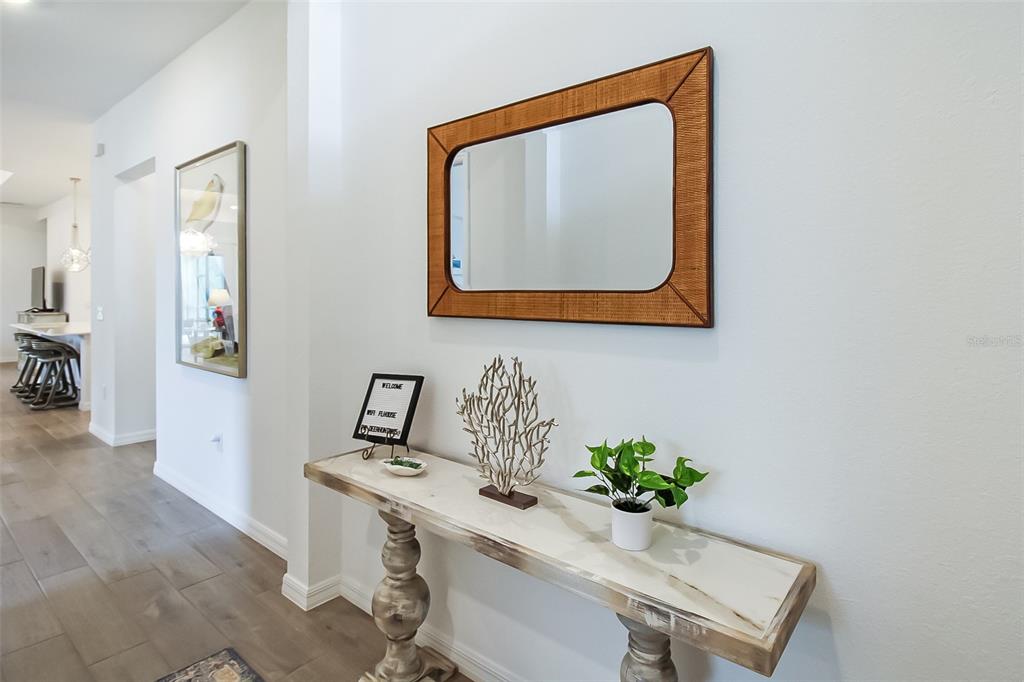 17335 Jadestone Court Venice, FL 34293 - Photo 4 of 54 a bathroom with a sink mirror and vanity