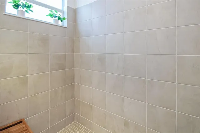 a dining room with furniture a large window and a table