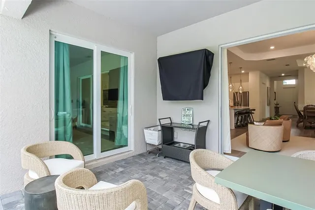 a view of a patio with a table and chairs