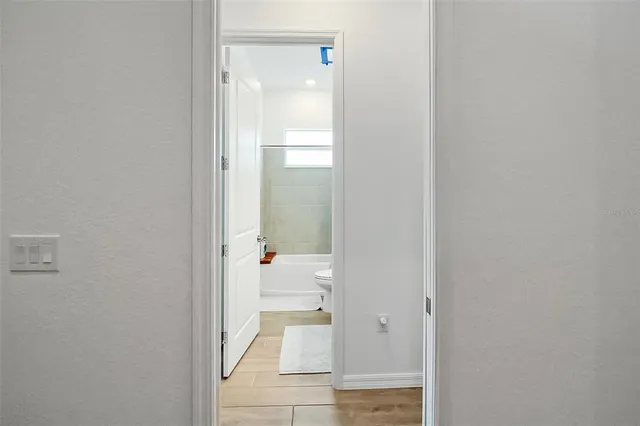 a bed room with a bed and a window