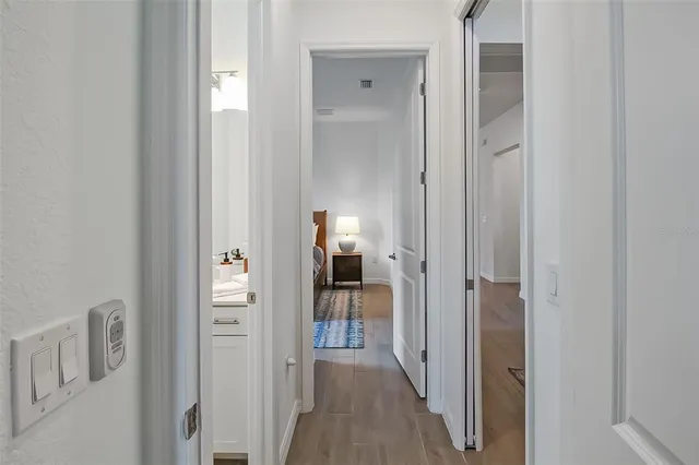 a bathroom with a sink a toilet a mirror and shower