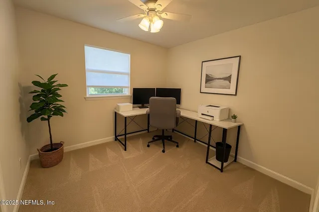 a view of a workspace with furniture