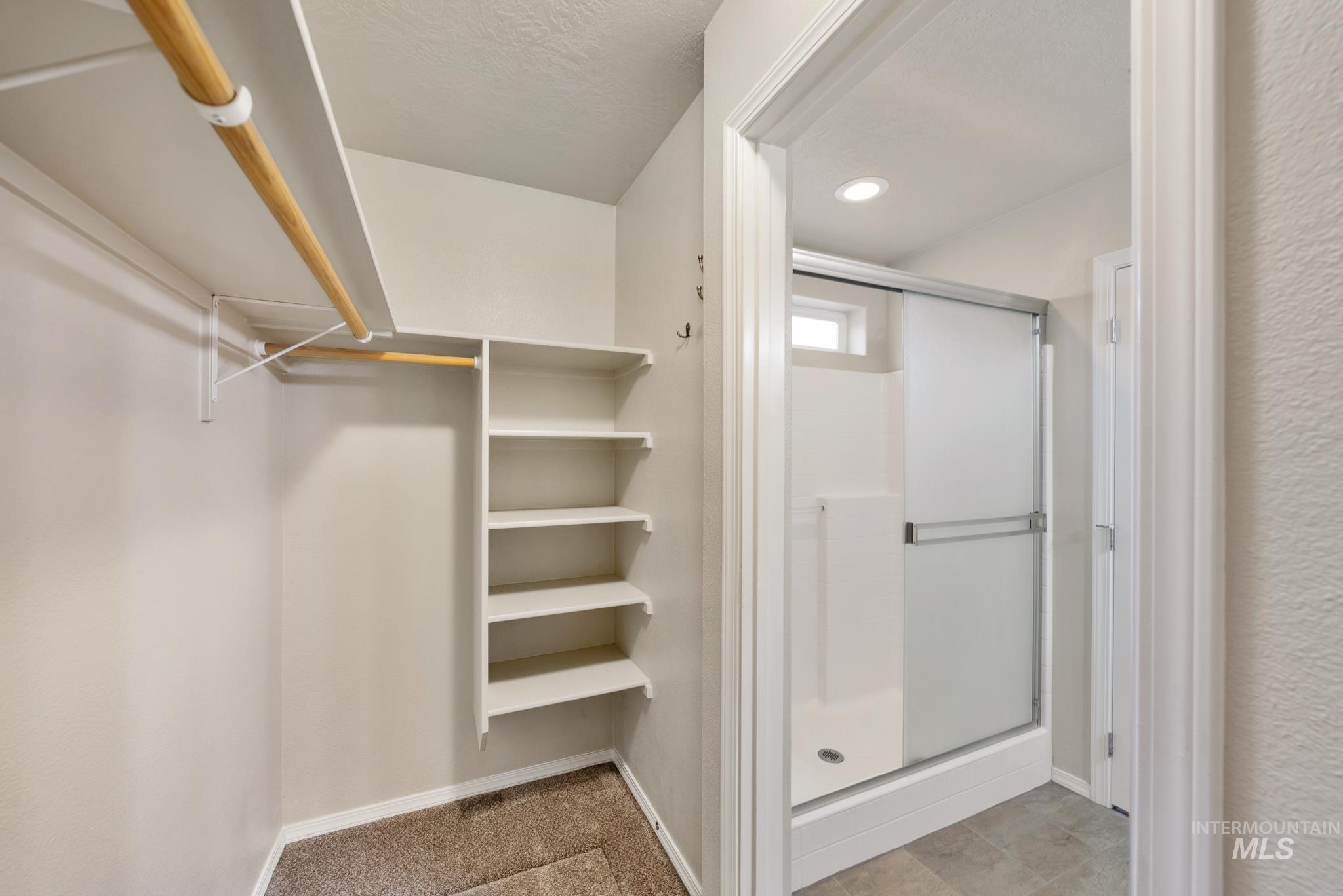 19081 Harley Way Caldwell, ID 83605 - Photo 16 of 35 Full bathroom with a stall shower and light carpet