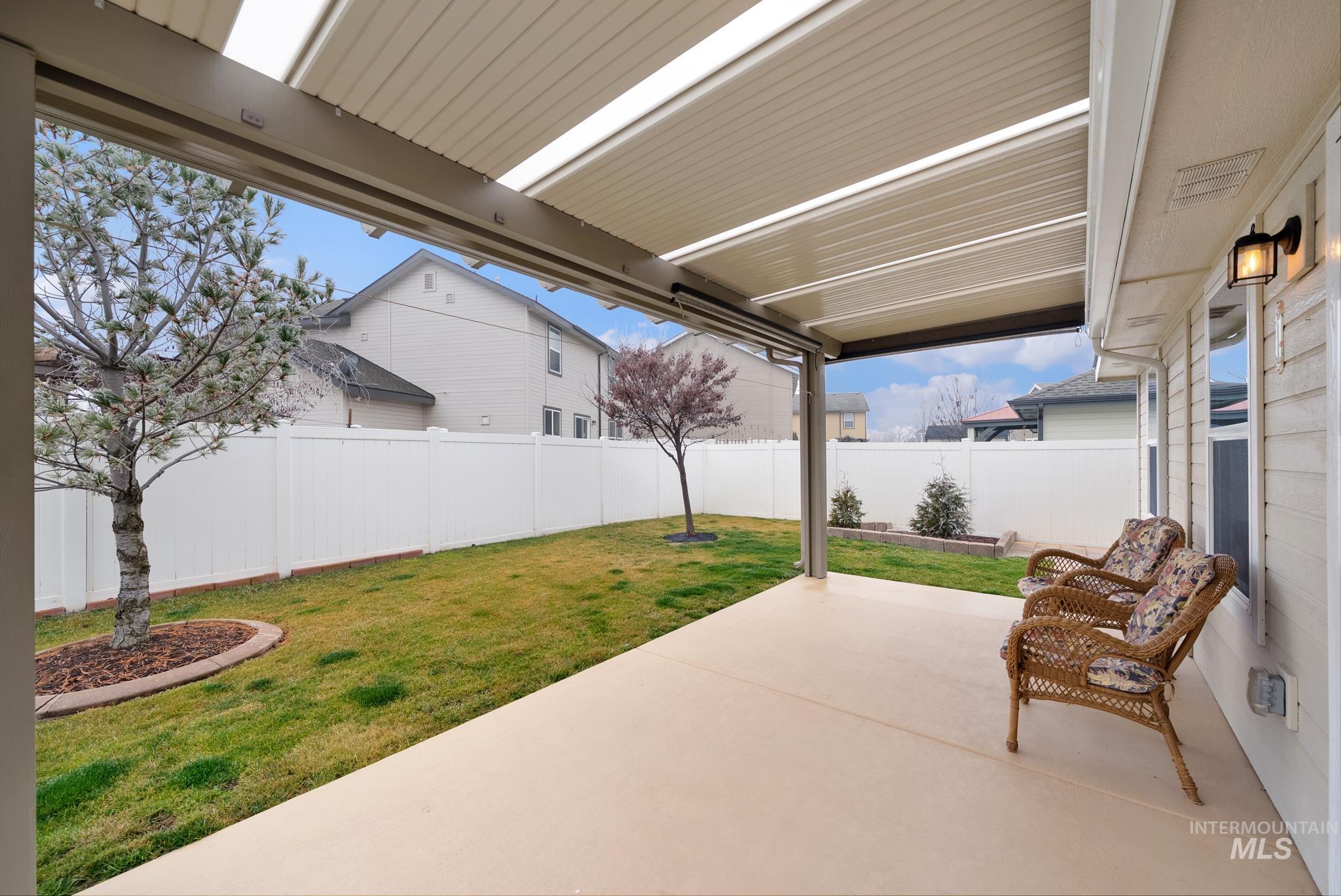 19081 Harley Way Caldwell, ID 83605 - Photo 24 of 35 Fenced backyard with a patio