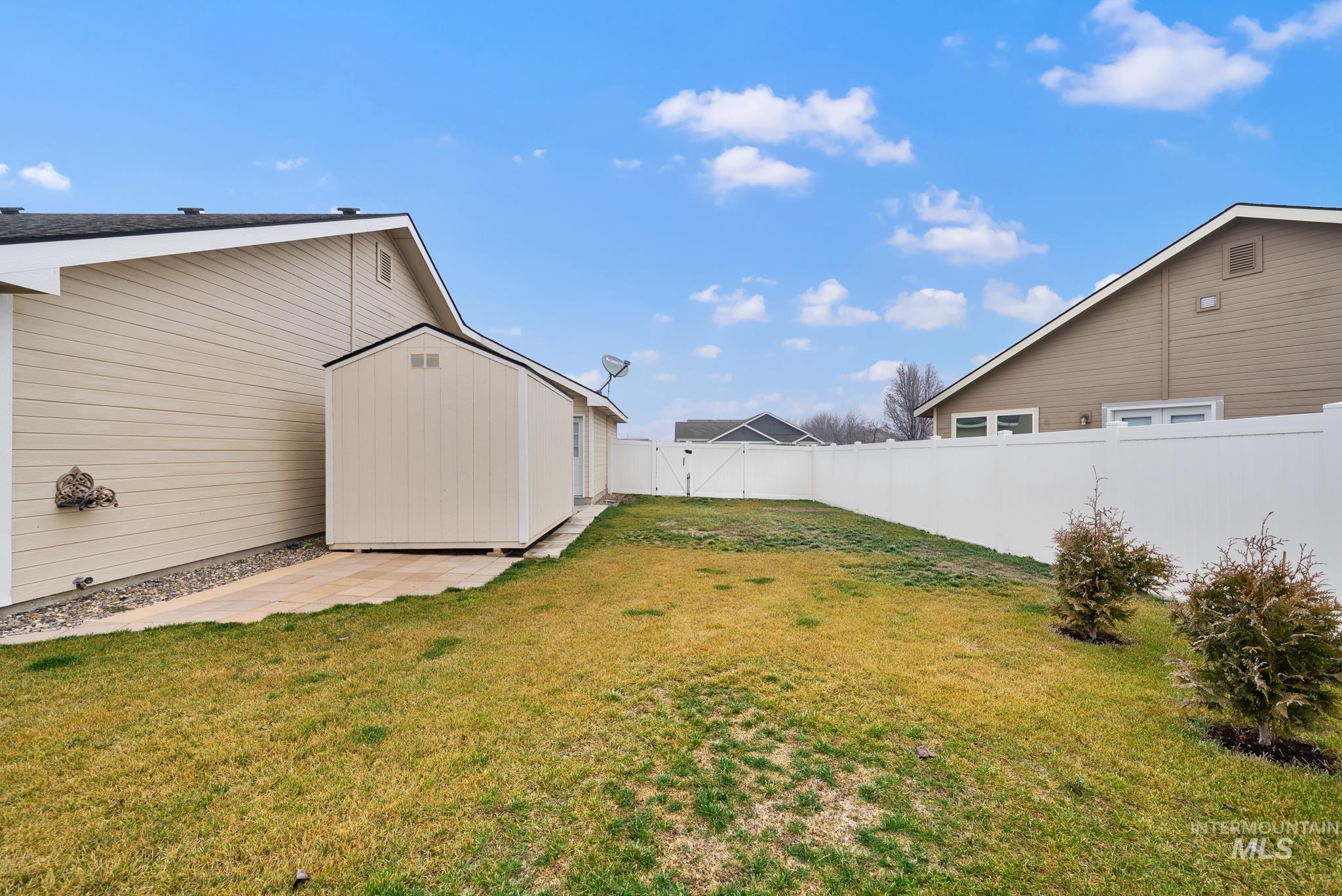 19081 Harley Way Caldwell, ID 83605 - Photo 27 of 35 Fenced backyard featuring a storage shed