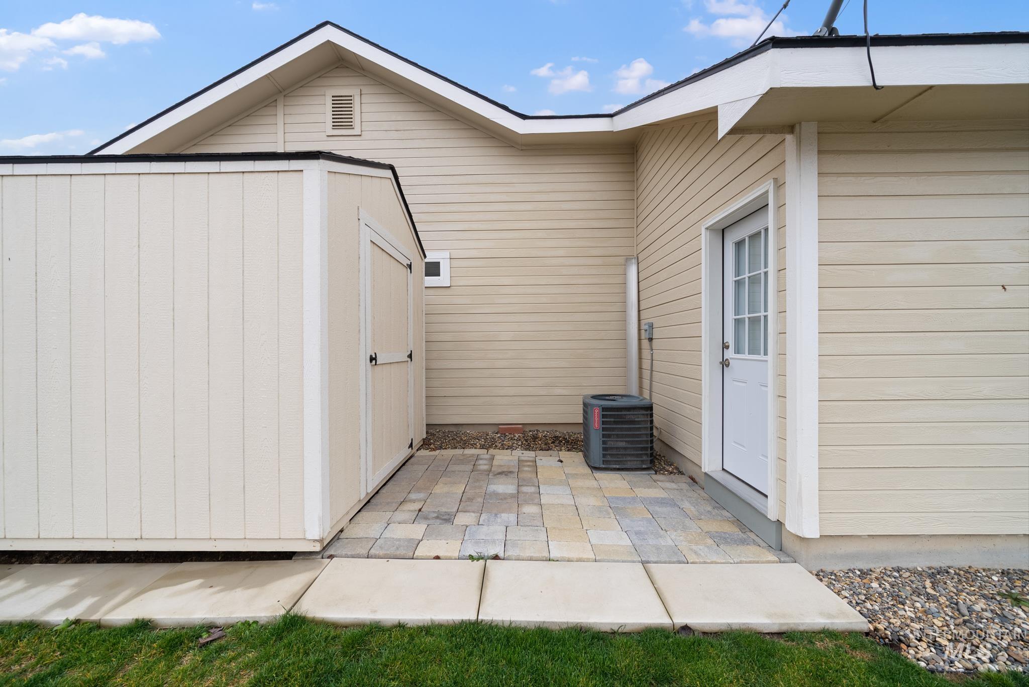 19081 Harley Way Caldwell, ID 83605 - Photo 28 of 35 View of home's exterior with a shed and a patio