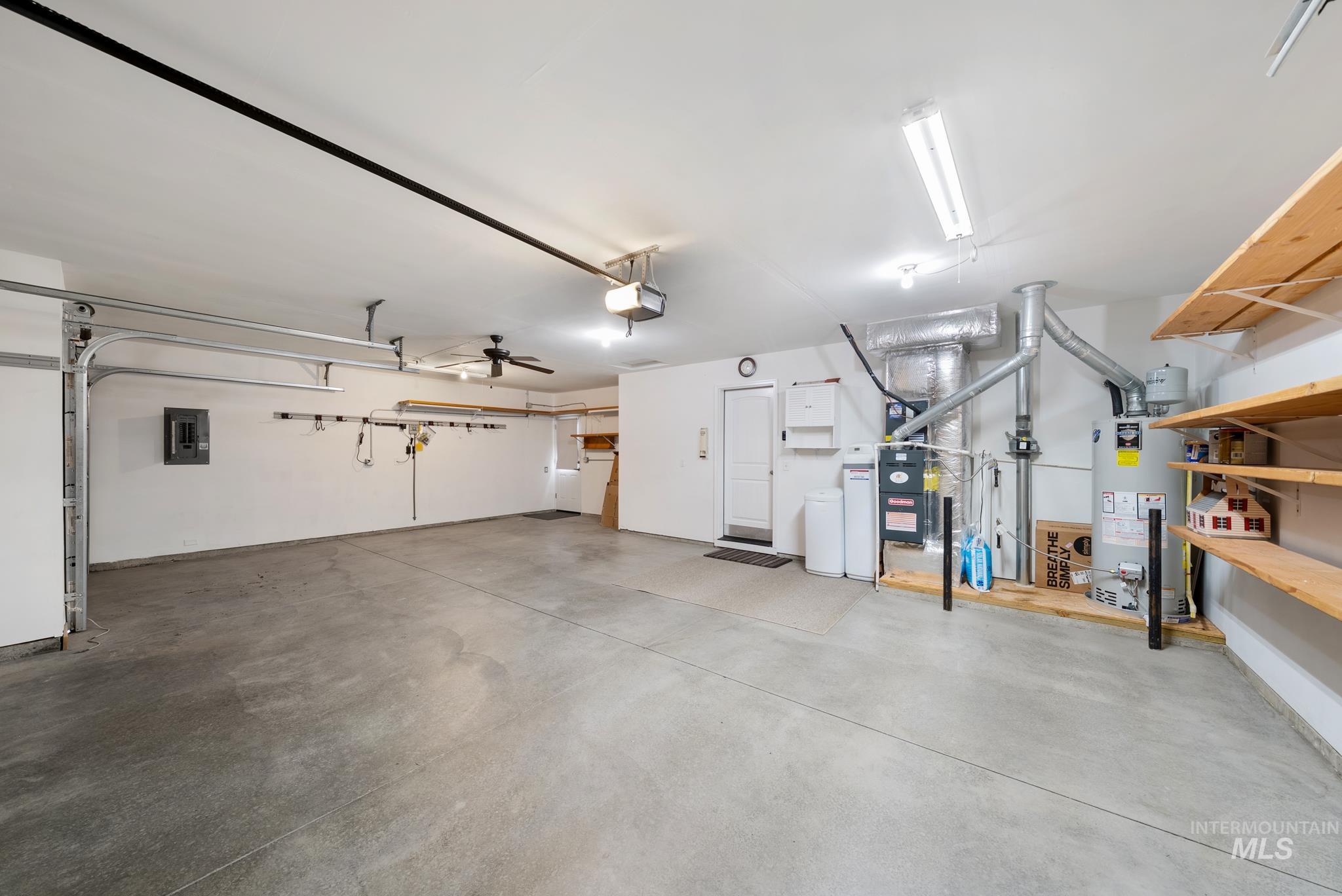 19081 Harley Way Caldwell, ID 83605 - Photo 29 of 35 Garage featuring gas water heater and electric panel