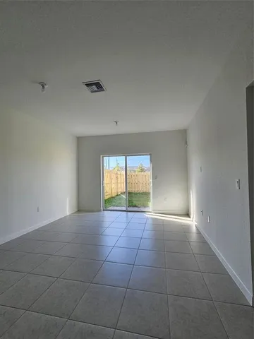 a view of an empty room and window