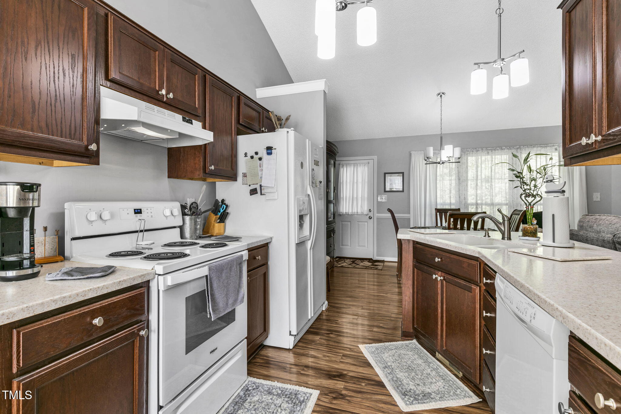 4317 Snow Goose Court Raleigh, NC 27616 - Photo 14 of 43 a kitchen with stainless steel appliances granite countertop a sink a stove and a refrigerator