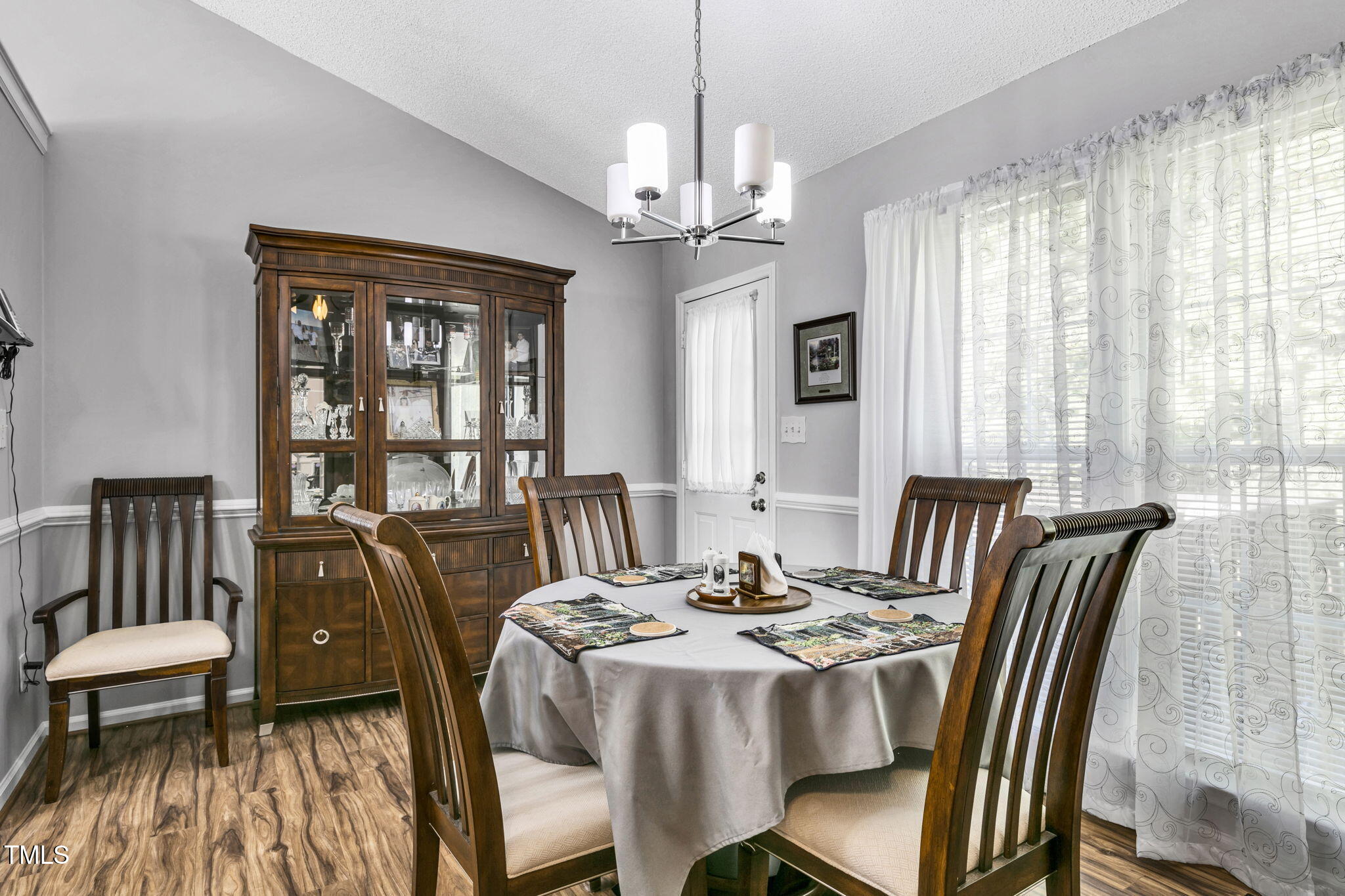 4317 Snow Goose Court Raleigh, NC 27616 - Photo 16 of 43 a view of a dining room with furniture window and outside view