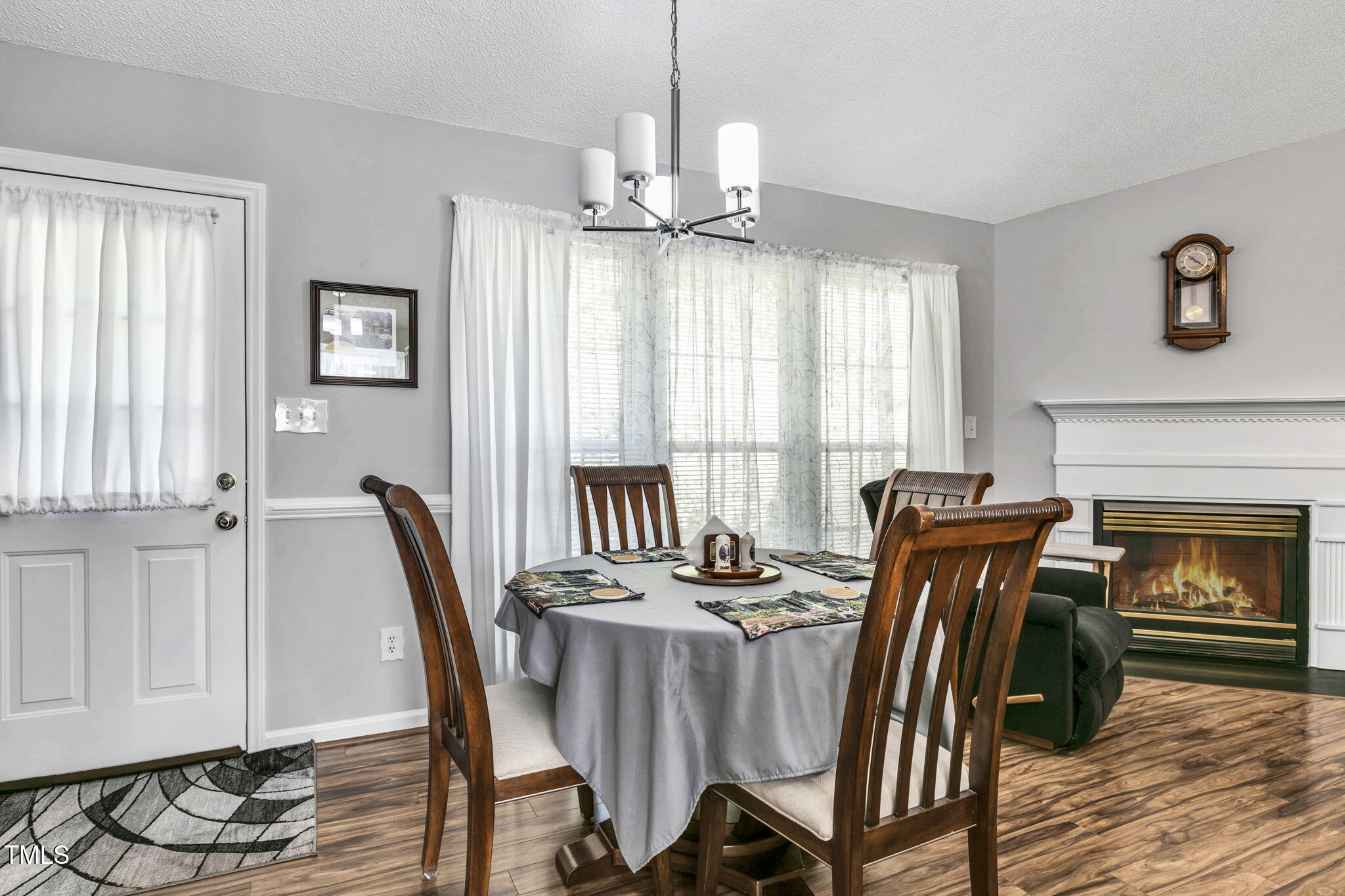 4317 Snow Goose Court Raleigh, NC 27616 - Photo 17 of 43 a view of a a dining room with furniture window and wooden floor