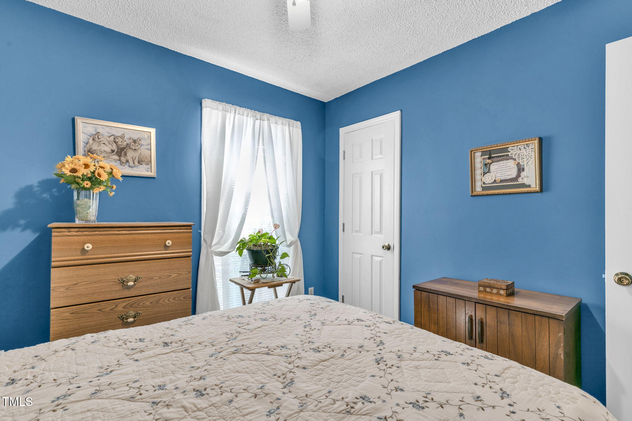 4317 Snow Goose Court Raleigh, NC 27616 - Photo 24 of 43 a bedroom with a bed and a dresser