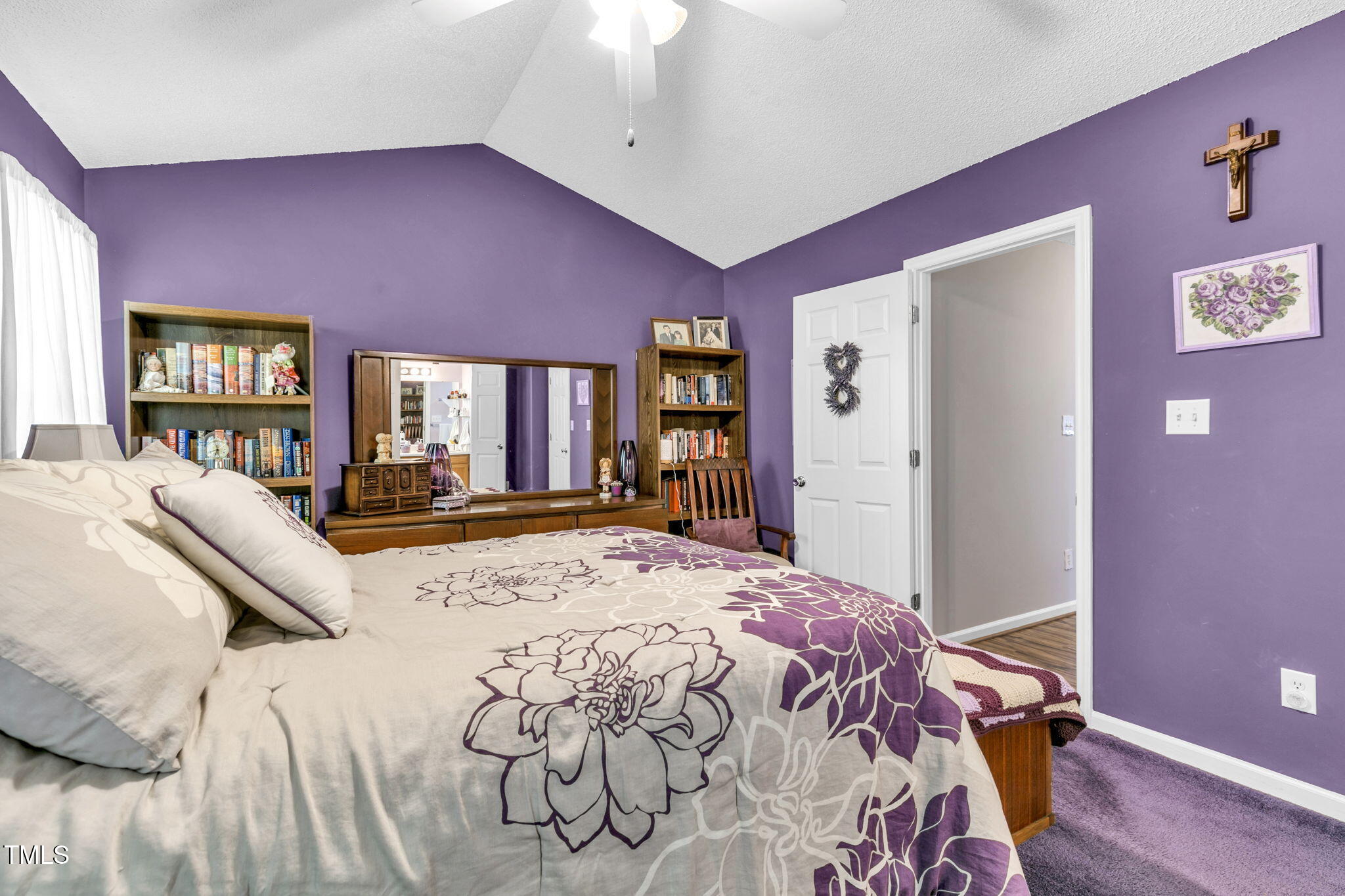 4317 Snow Goose Court Raleigh, NC 27616 - Photo 26 of 43 a bed room with a bed and a chandelier