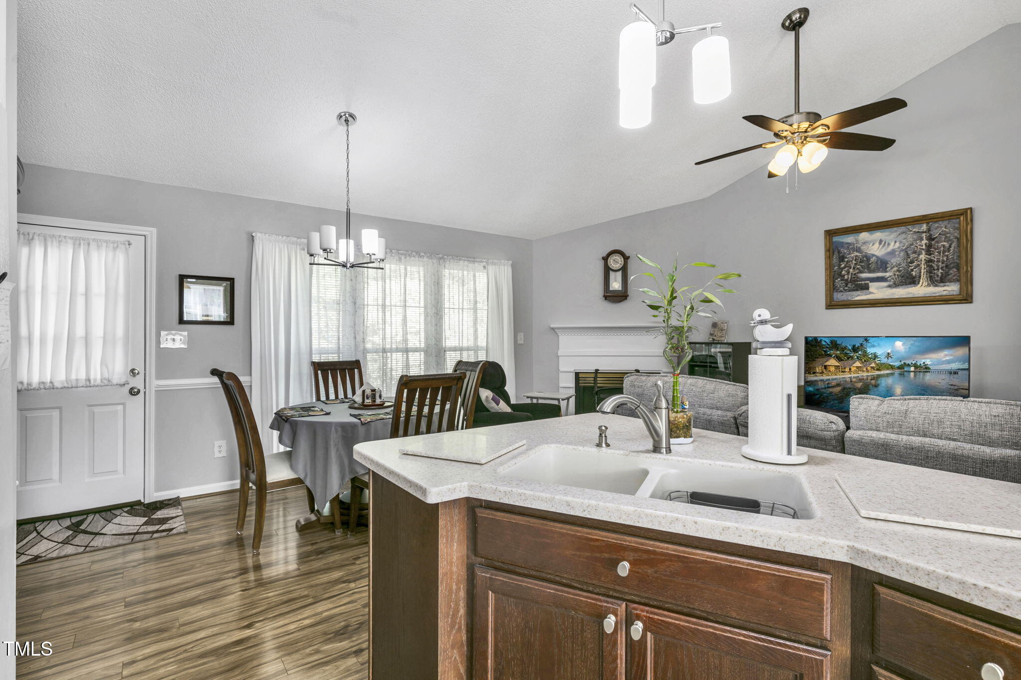 4317 Snow Goose Court Raleigh, NC 27616 - Photo 32 of 43 a view of a dining room with furniture window and wooden floor