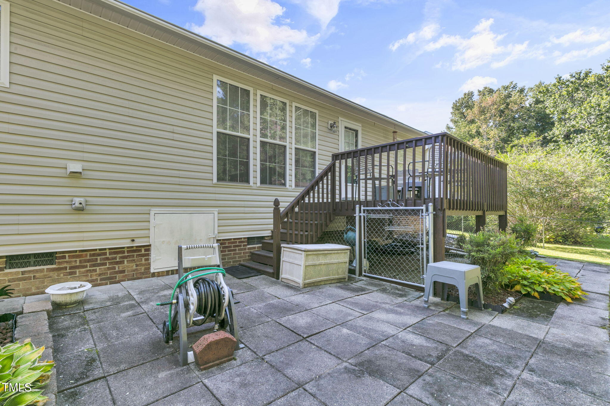 4317 Snow Goose Court Raleigh, NC 27616 - Photo 38 of 43 a house with a bench in front of it