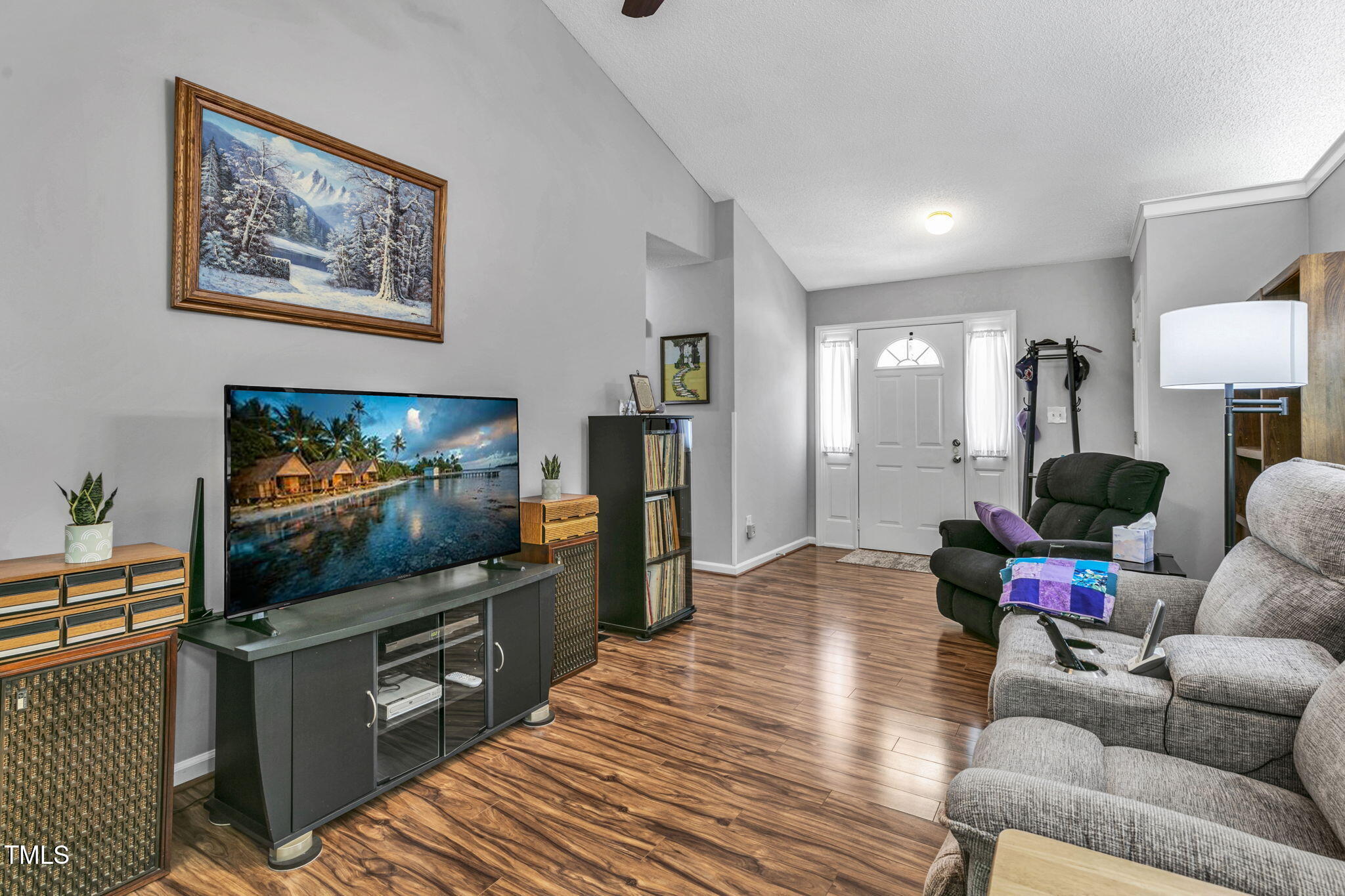 4317 Snow Goose Court Raleigh, NC 27616 - Photo 6 of 43 a living room with furniture and a flat screen tv
