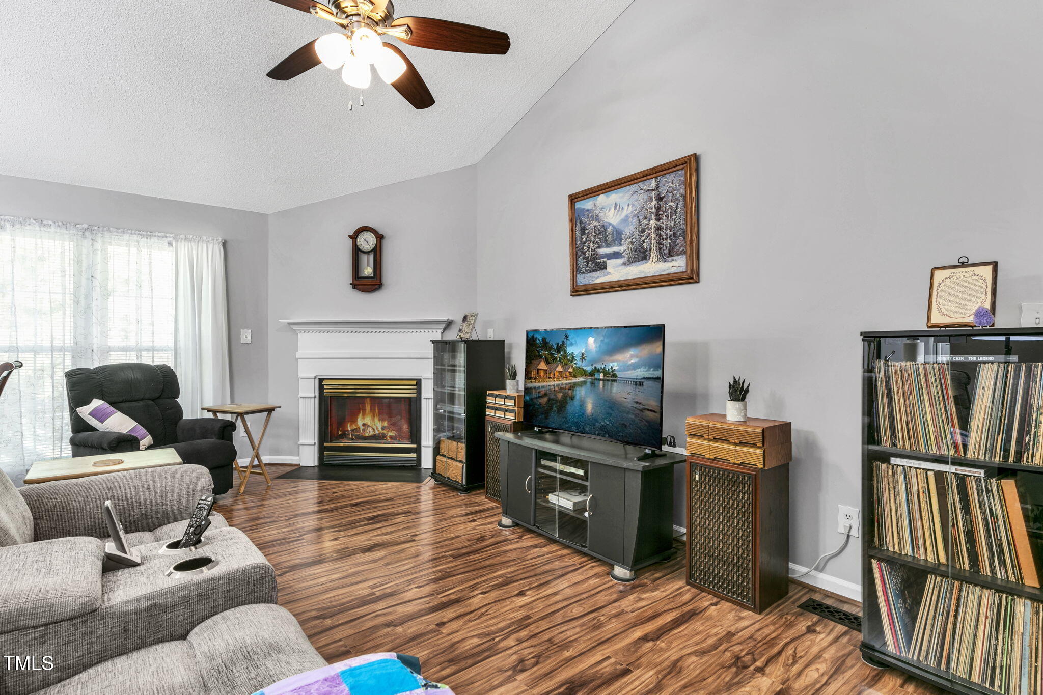 4317 Snow Goose Court Raleigh, NC 27616 - Photo 8 of 43 a living room with furniture fireplace and flat screen tv