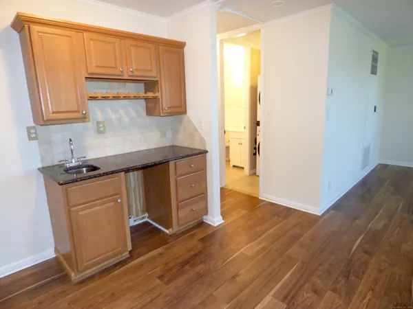 a kitchen with stainless steel appliances a sink and a refrigerator