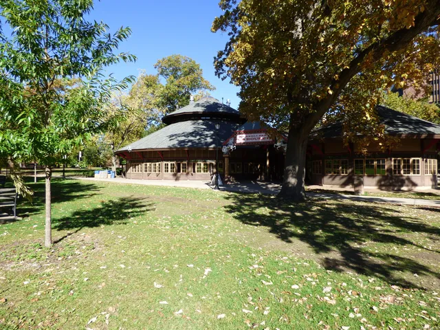 a view of a park with large trees