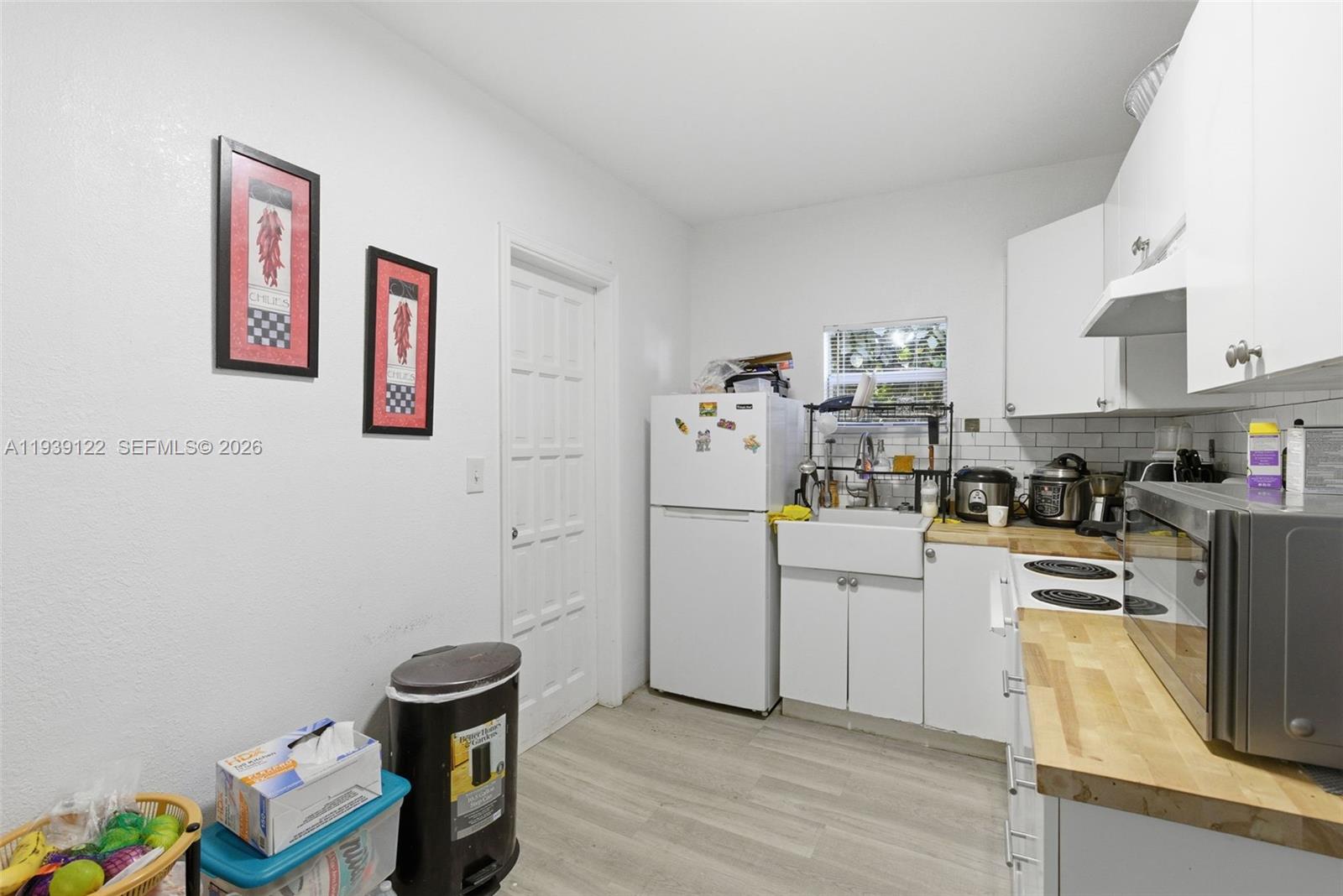 2142 Northwest 33rd Street Miami, FL 33142 - Photo 11 of 26 a room with storage and utility