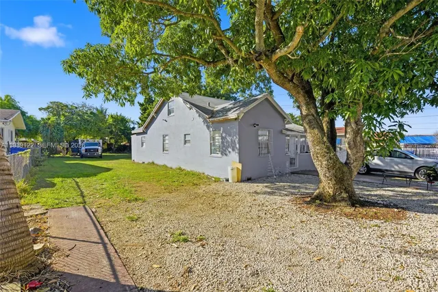 a house with a tree in front of it