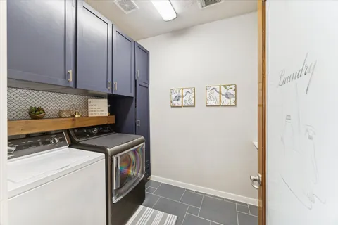a view of a room with furniture and wooden floor