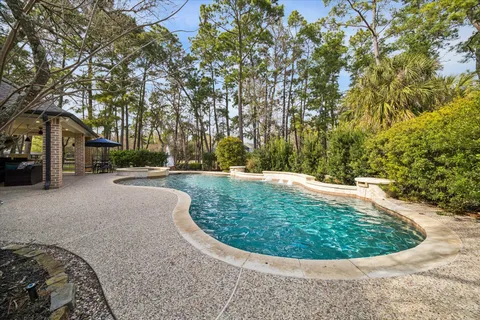 a view of a house with a backyard and porch