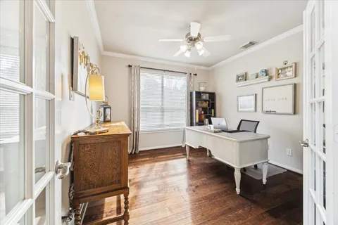 a view of a livingroom with furniture window and wooden floor