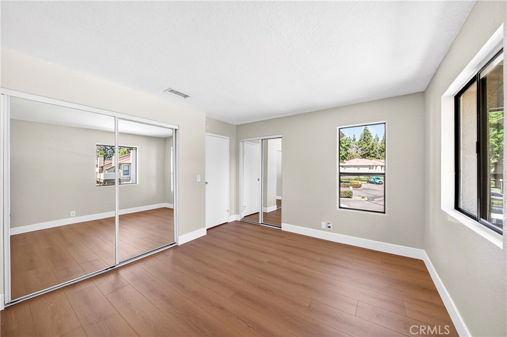 10151 Arrow Route, Unit 26 Rancho Cucamonga, CA 91730 - Photo 16 of 35 an empty room with windows