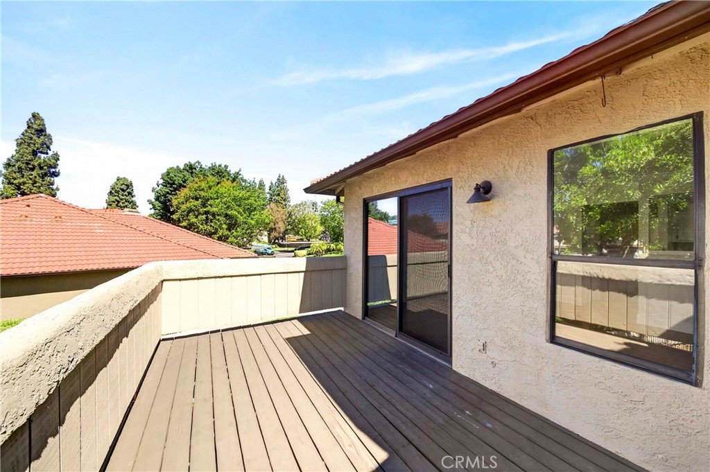 10151 Arrow Route, Unit 26 Rancho Cucamonga, CA 91730 - Photo 19 of 35 a view of balcony with two chairs and wooden floor