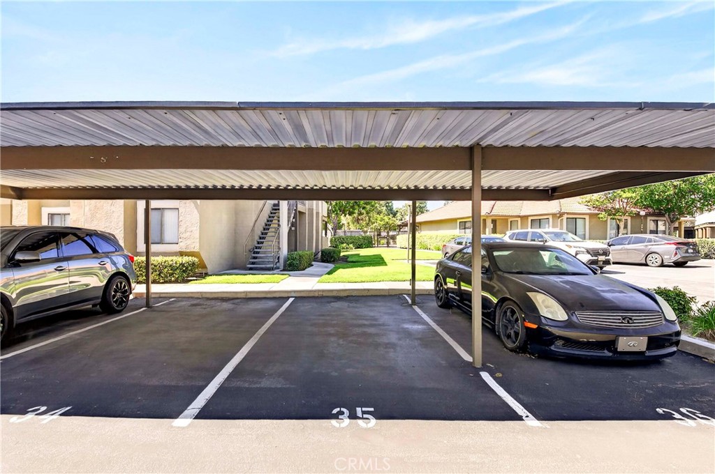 10151 Arrow Route, Unit 26 Rancho Cucamonga, CA 91730 - Photo 21 of 35 a view of a cars park in front of a building