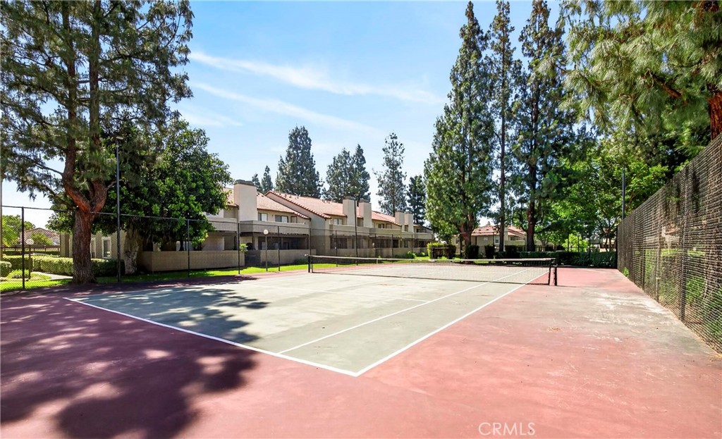 10151 Arrow Route, Unit 26 Rancho Cucamonga, CA 91730 - Photo 25 of 35 a swimming pool with trees in front of it